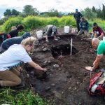 Anthropology students dig in the dirt near Fort Missoula.